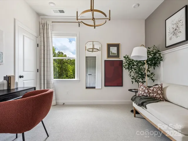 a living room with furniture and window