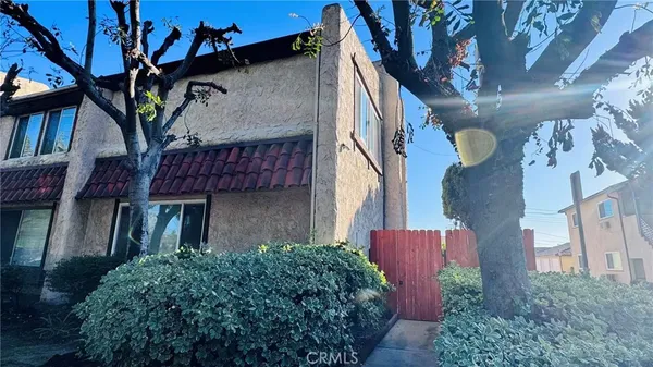 a view of a house with a tree