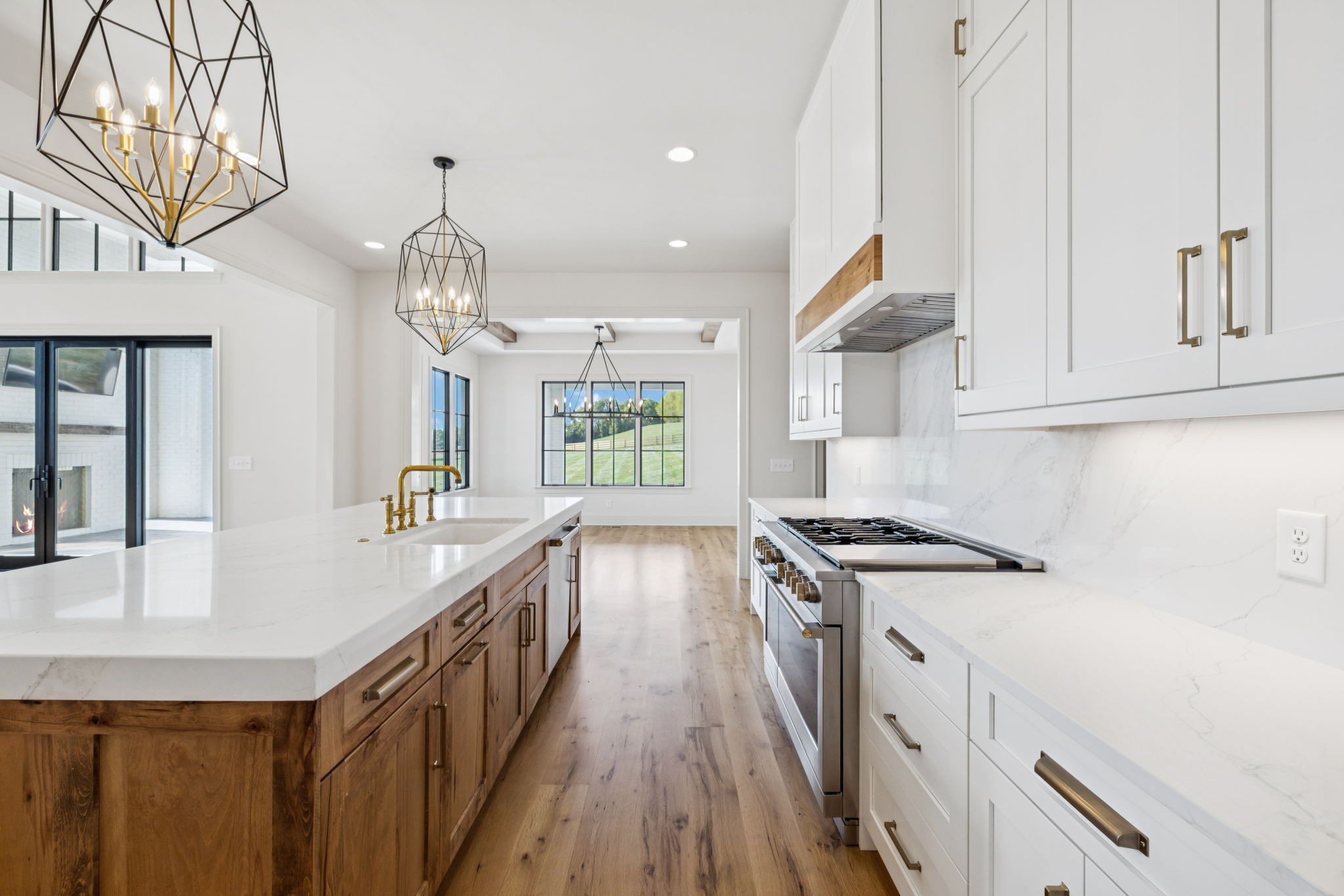 2245 Skinner Road Arrington, TN 37014 - Photo 39 of 98 a kitchen with stainless steel appliances granite countertop a sink a stove and a wooden floors