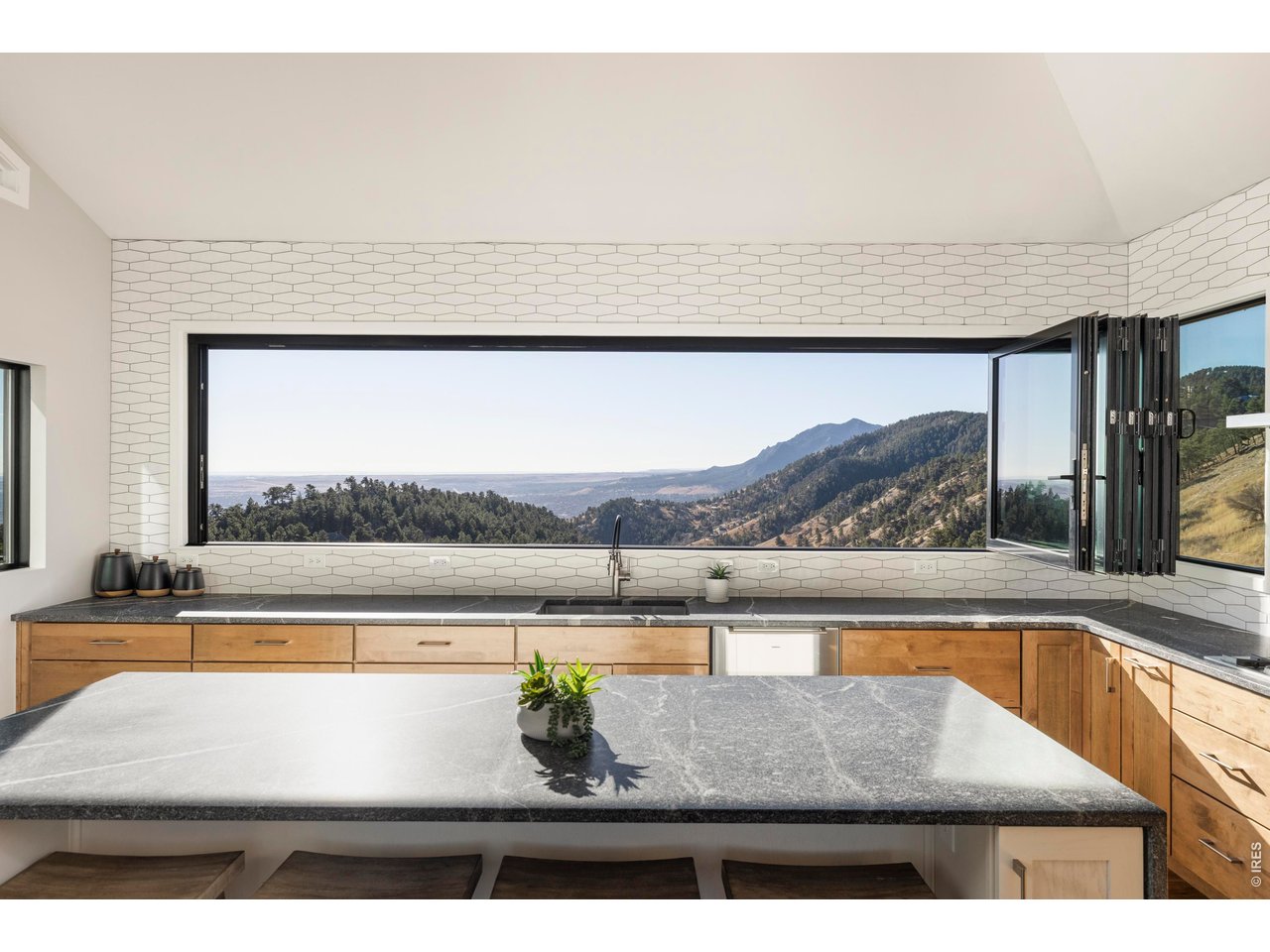 150 Valley View Way Boulder, CO 80304 - Photo 2 of 36 The 16' window above the kitchen sink opens entirely, bringing mountain air directly into the heart of the home.