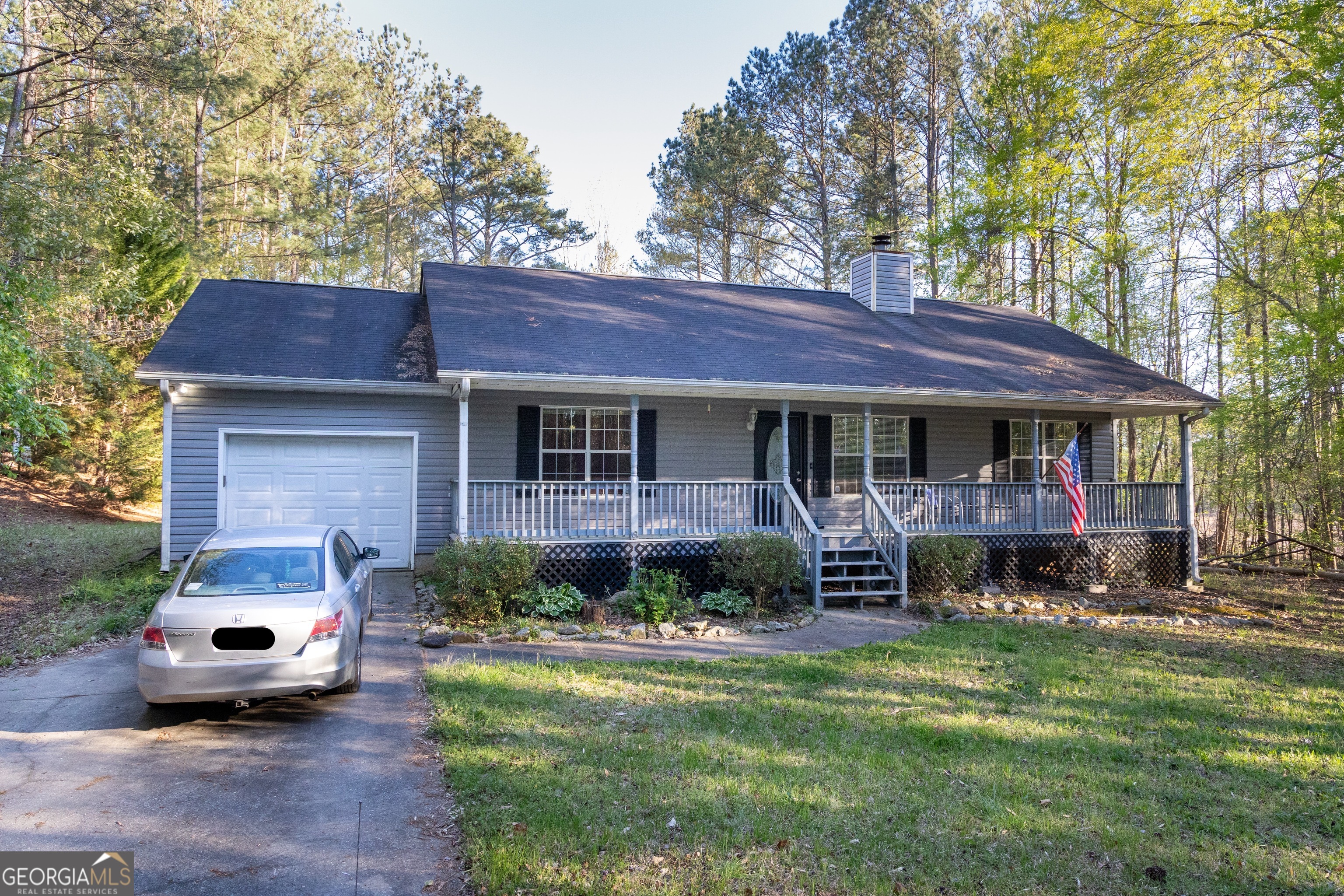 146 Boone Road Newnan, GA 30263 - Photo 1 of 1 a view of a house with a yard and sitting area