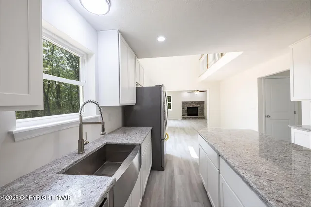 a kitchen with a stove and a cabinets