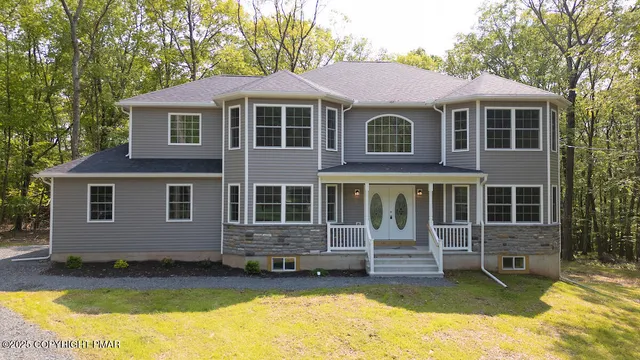 a view of a house with a yard outdoor seating and yard
