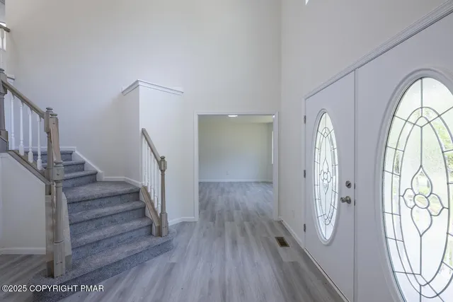 a view of entryway with wooden floor