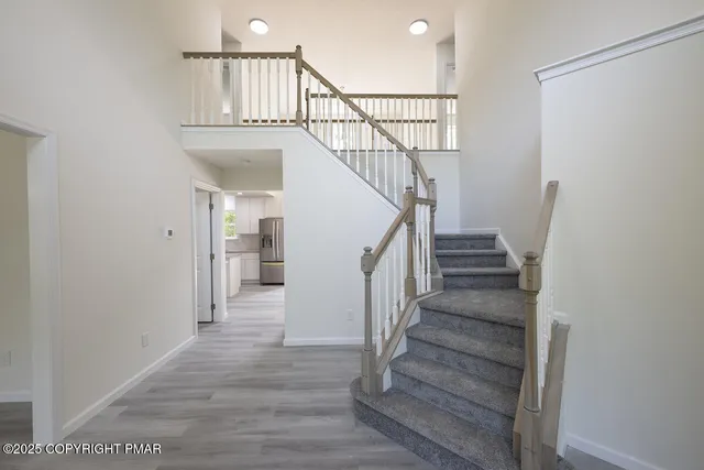 a view of a hallway with windows