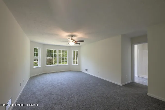 a bathroom with a double vanity sink toilet and a mirror