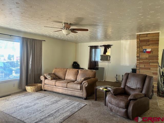 726 East 3rd Street Cortez, CO 81321 - Photo 5 of 20 a living room with furniture and a window