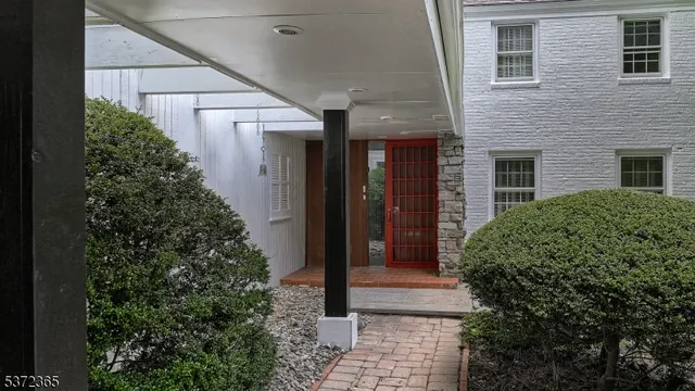 a view of a pathway besides a house