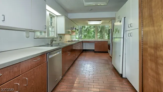 a bathroom with a large mirror sink and bathtub