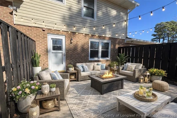 a outdoor space with patio the couches and potted plants with sky view