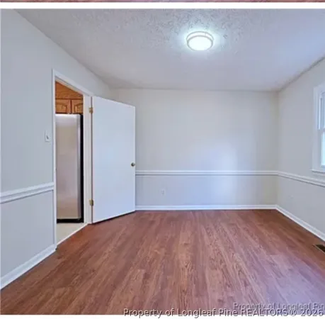 a view of a dining room with furniture and window