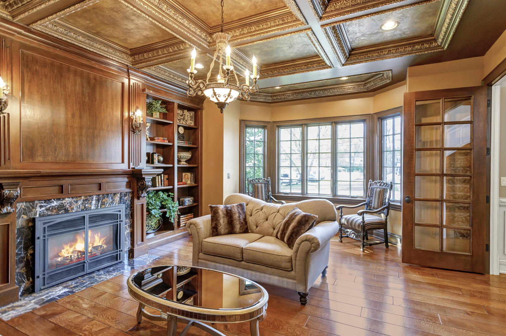 400 West Maple Avenue Roselle, IL 60172 - Photo 11 of 91 a living room with furniture a chandelier and a large window