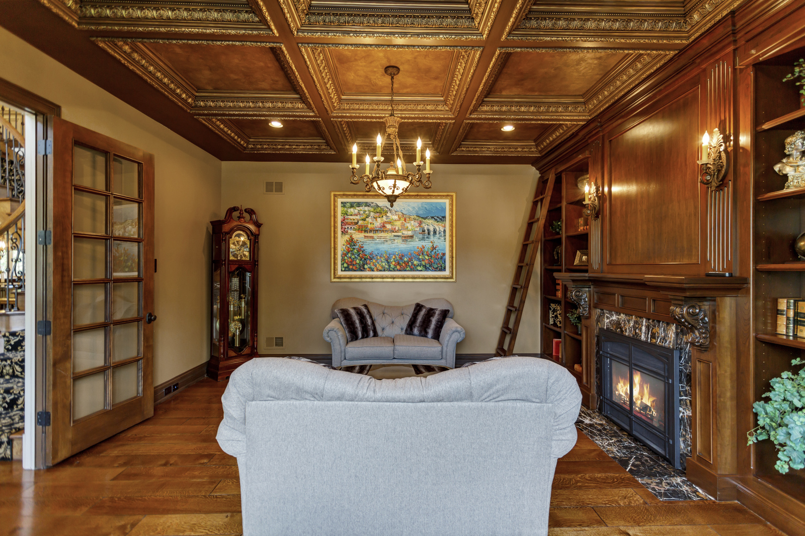 400 West Maple Avenue Roselle, IL 60172 - Photo 12 of 91 a living room with furniture a chandelier and a flat screen tv