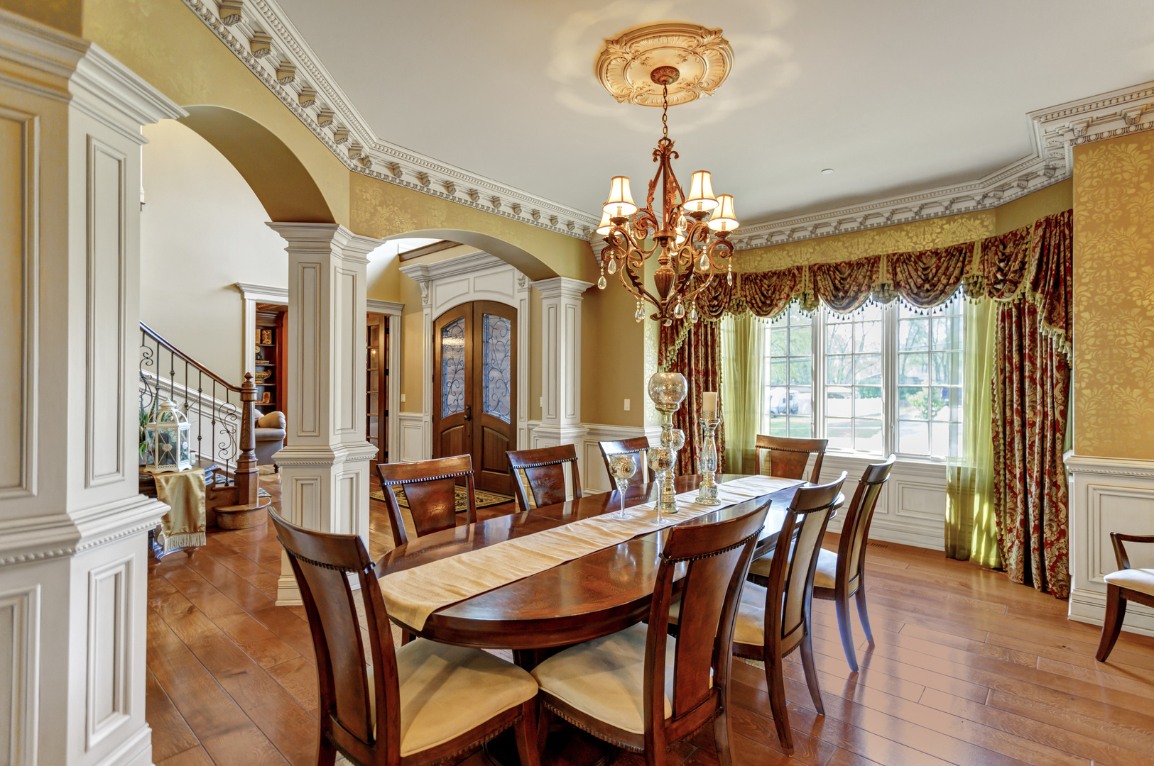 400 West Maple Avenue Roselle, IL 60172 - Photo 14 of 91 a view of a dining room with furniture a chandelier and wooden floor