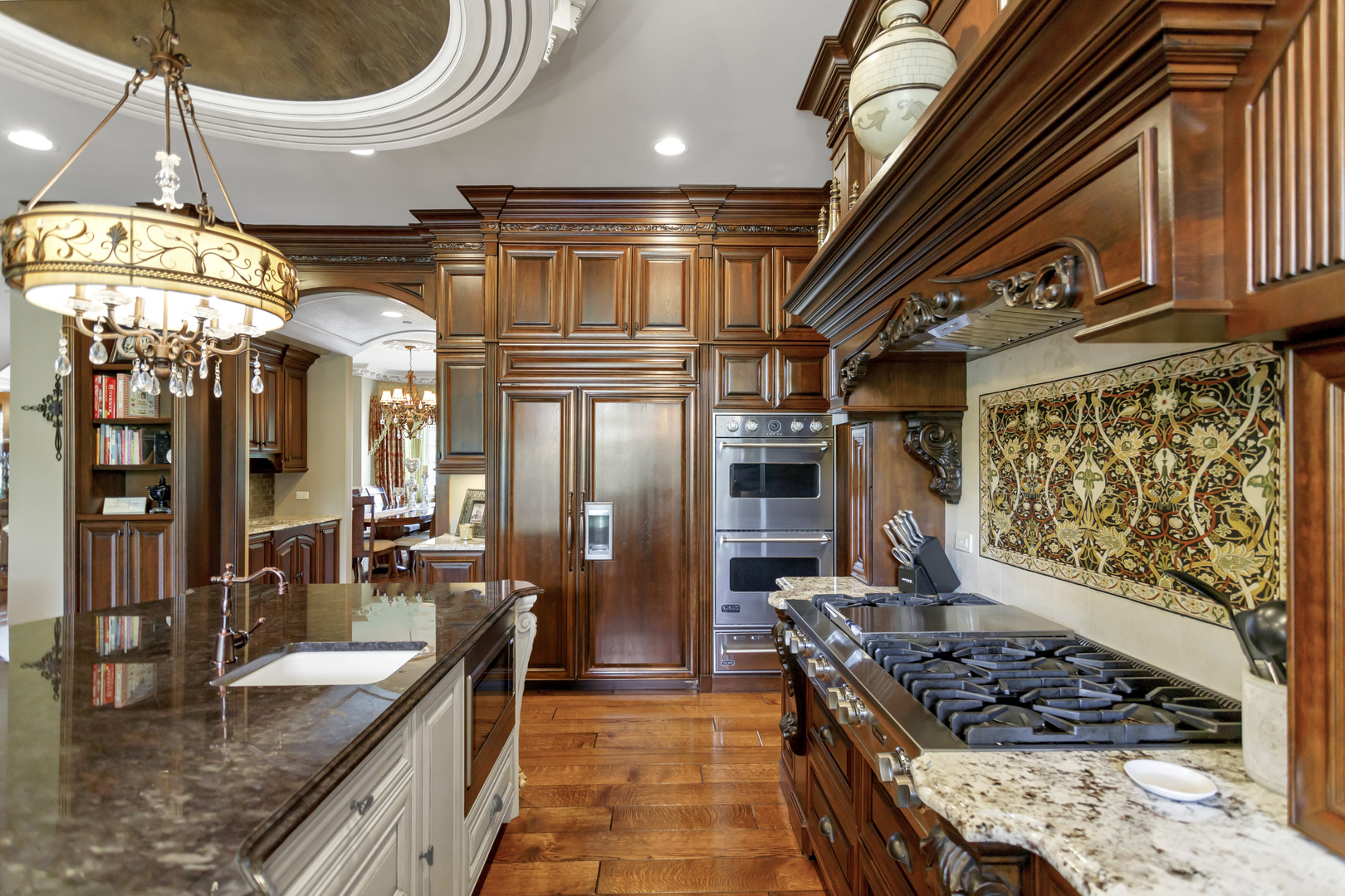 400 West Maple Avenue Roselle, IL 60172 - Photo 21 of 91 a kitchen with stainless steel appliances granite countertop a stove a sink and a refrigerator