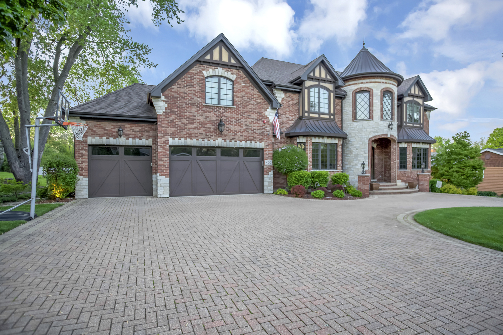400 West Maple Avenue Roselle, IL 60172 - Photo 3 of 91 a front view of a house with a yard and garage
