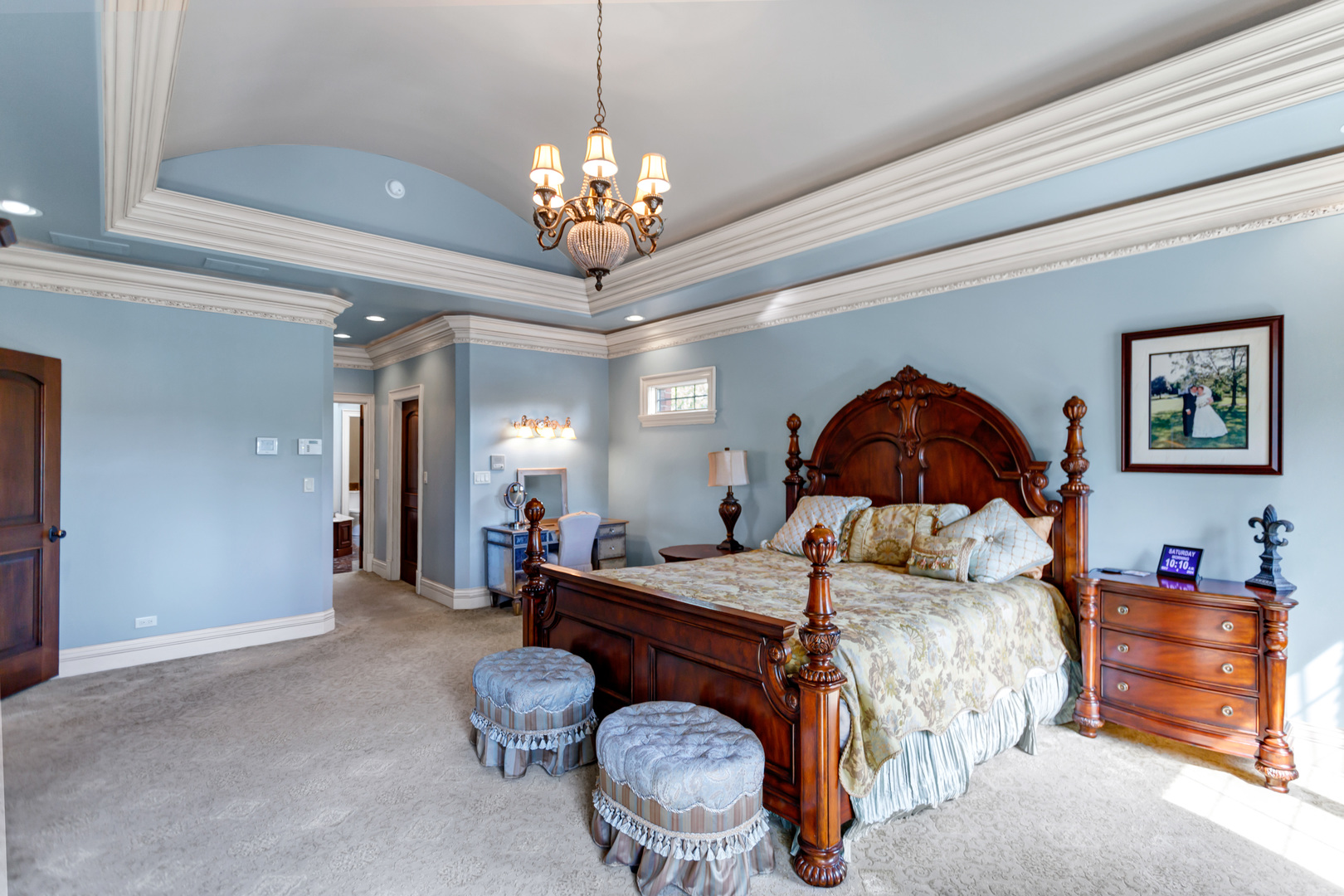 400 West Maple Avenue Roselle, IL 60172 - Photo 37 of 91 a bedroom with a bed and a chandelier