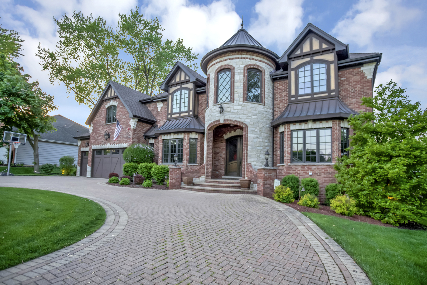 400 West Maple Avenue Roselle, IL 60172 - Photo 4 of 91 a front view of a house with a garden and trees