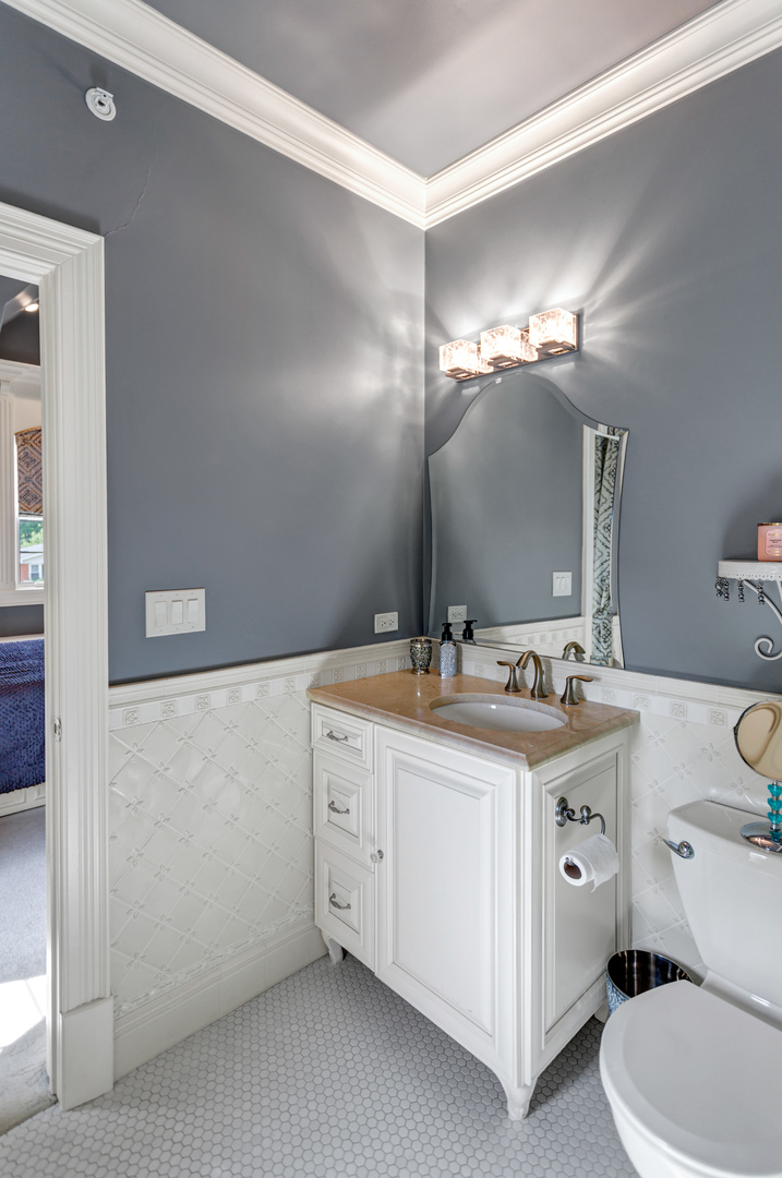 400 West Maple Avenue Roselle, IL 60172 - Photo 48 of 91 a bathroom with a sink a toilet and a mirror