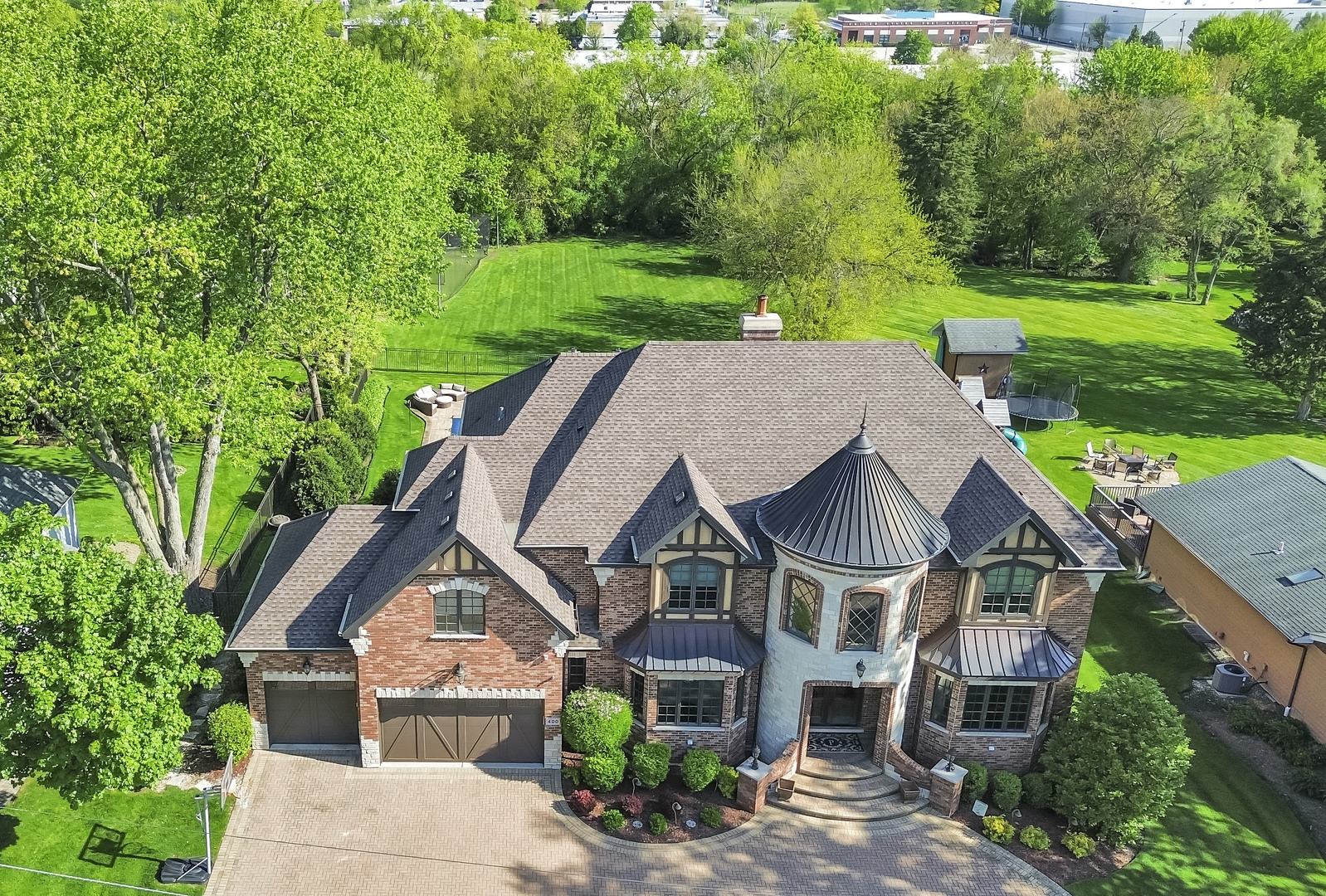 400 West Maple Avenue Roselle, IL 60172 - Photo 5 of 91 a aerial view of a house next to a big yard and large trees