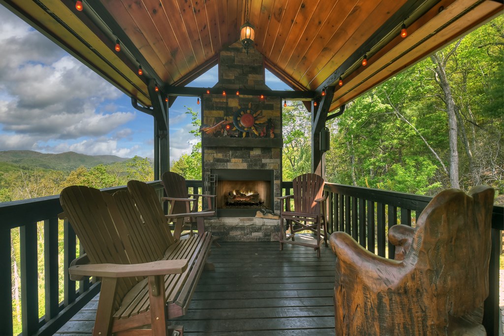 459 Quail Ridge Road Epworth, GA 30541 - Photo 7 of 73 a view of a balcony with chairs and wooden floor