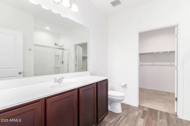 a bathroom with a glass shower door