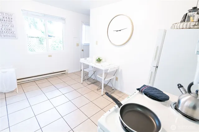 a bathroom with a sink mirror and toilet