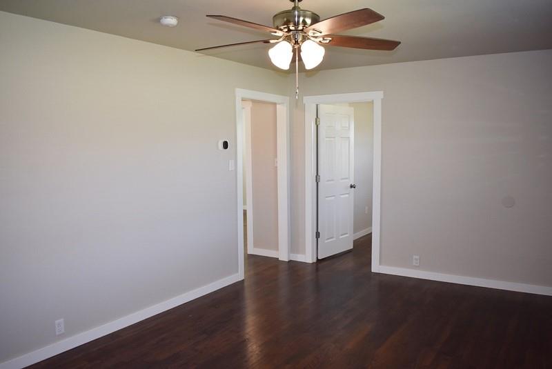 541 South Allen Street, Unit A Boyd, TX 76023 - Photo 7 of 15 a view of an empty room with wooden floor