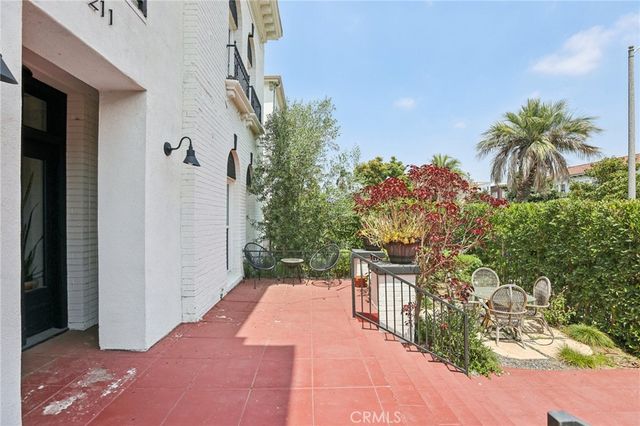 a balcony view with a garden