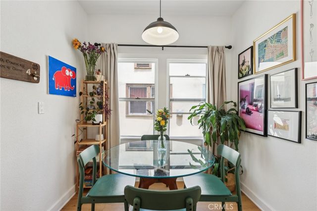 a dining room with furniture and window