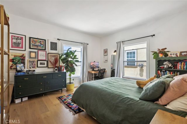 a bedroom with a bed furniture and a window