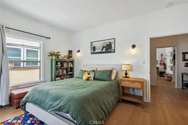 a bedroom with a large bed and a window