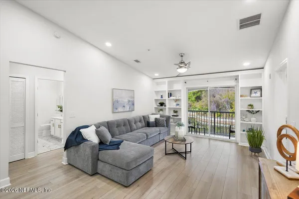 a living room with furniture and a large window