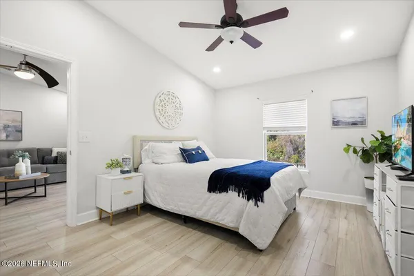 a bed room with a bed and a window