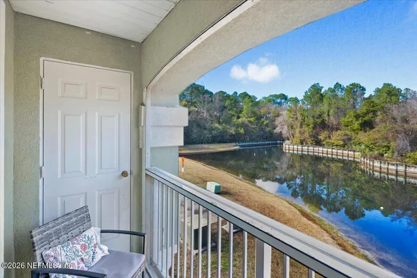 a view of a balcony with lake view