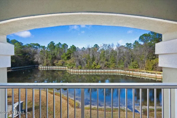 a view of a lake from a balcony