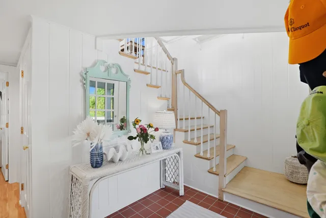 a bedroom with a bed and a mirror