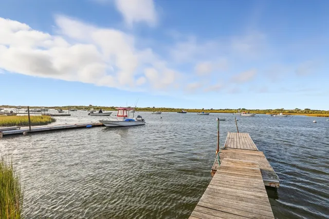 a house view with a lake view
