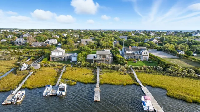 an aerial view of a house with a swimming pool