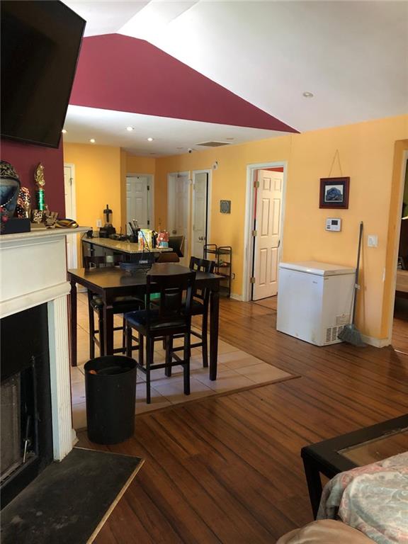 4064 Blanton Avenue Southwest Atlanta, GA 30331 - Photo 2 of 9 a view of a dining room with furniture and wooden floor