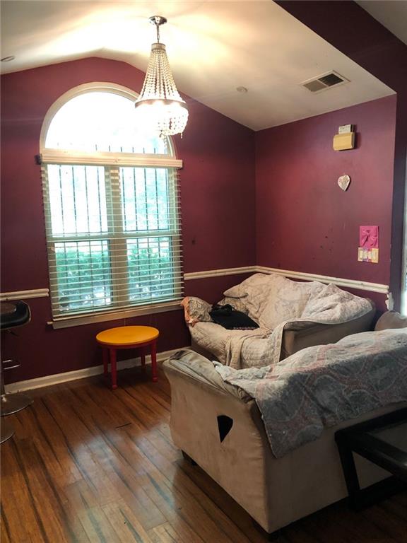 4064 Blanton Avenue Southwest Atlanta, GA 30331 - Photo 3 of 9 a bedroom with furniture and a window
