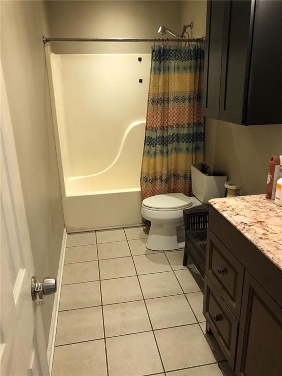 4064 Blanton Avenue Southwest Atlanta, GA 30331 - Photo 5 of 9 a bathroom with a granite countertop sink toilet and shower