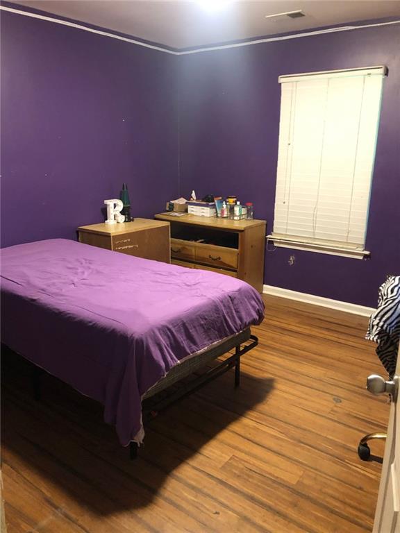 4064 Blanton Avenue Southwest Atlanta, GA 30331 - Photo 6 of 9 a bedroom with a bed and a window