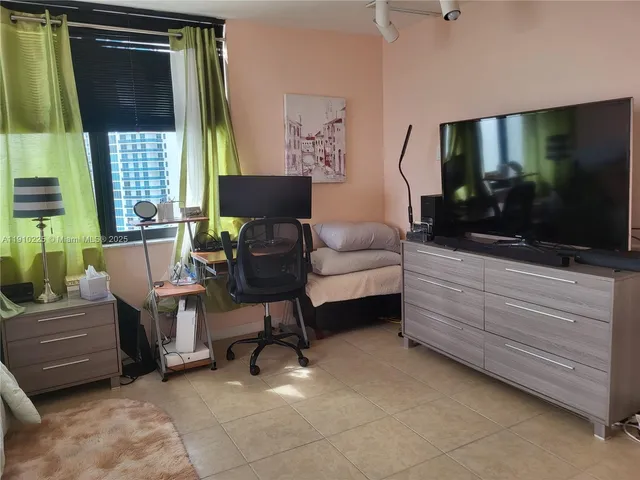 a bathroom with a granite countertop toilet a sink and a mirror