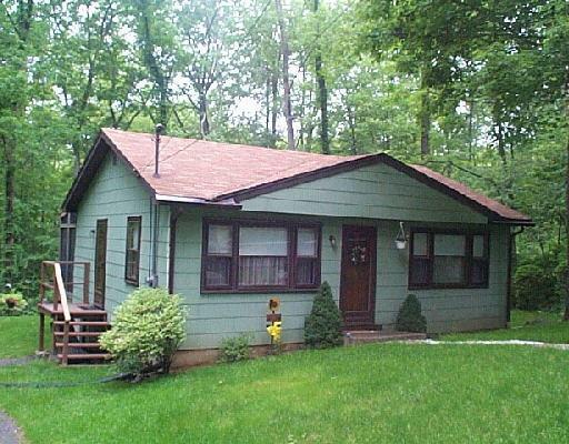 116 Green Pond Road New Milford, CT 06776 - Photo 1 of 1 a front view of a house with a garden and yard