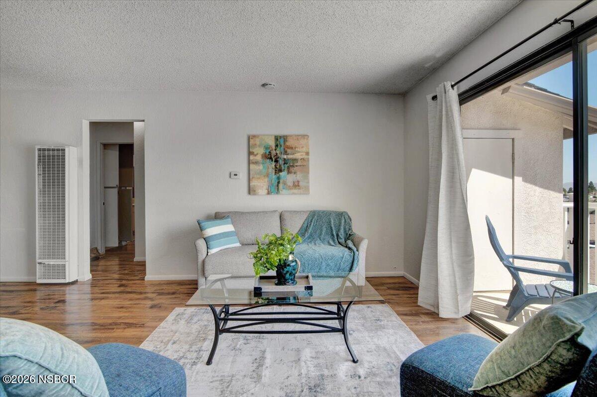 3400 Santa Maria Way, Unit 207B Santa Maria, CA 93455 - Photo 11 of 50 a living room with furniture and a large window