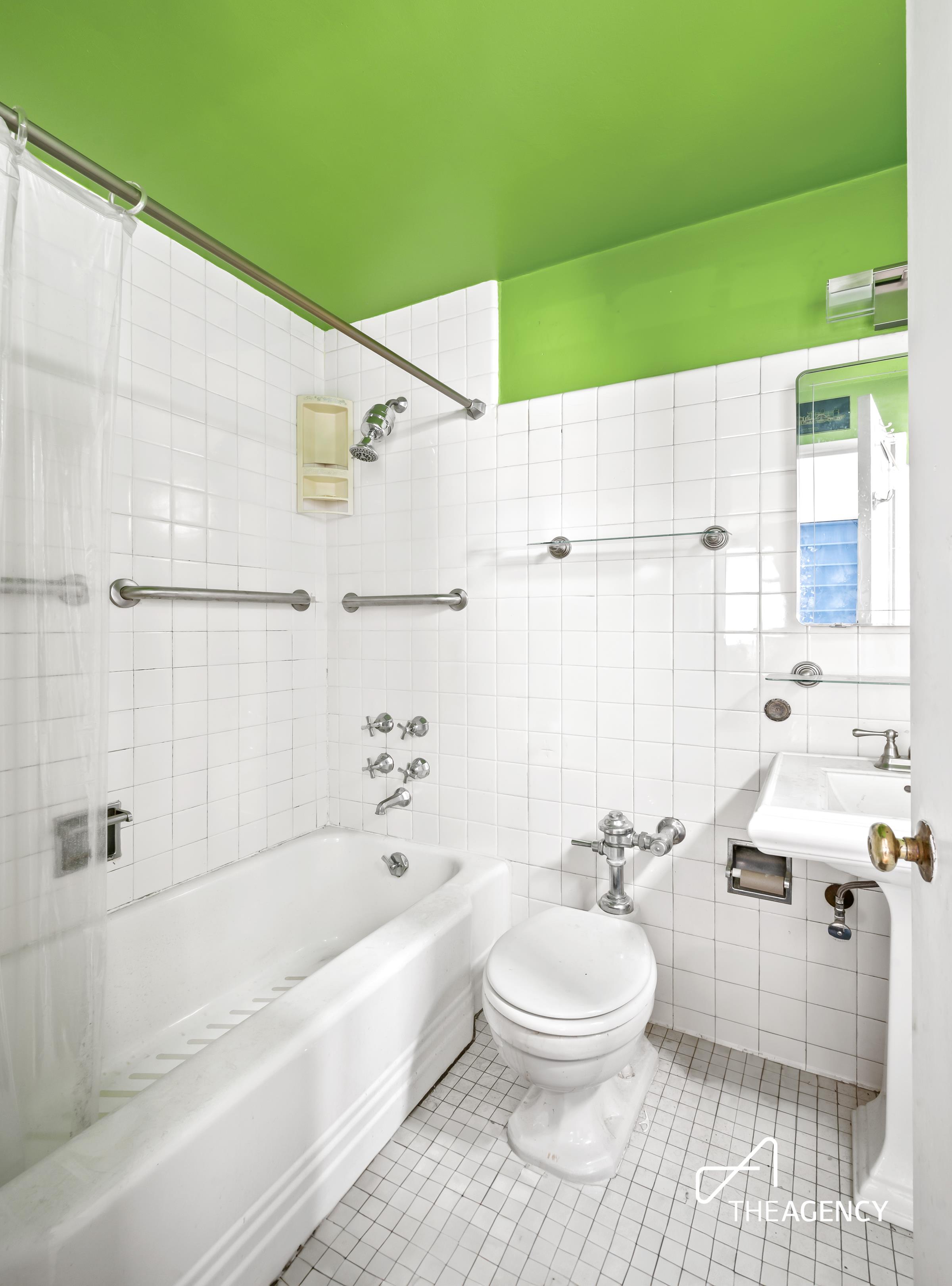 3 East 71st Street, Unit 2E Manhattan, NY 10021 - Photo 9 of 10 a bathroom with a toilet a sink and bathtub