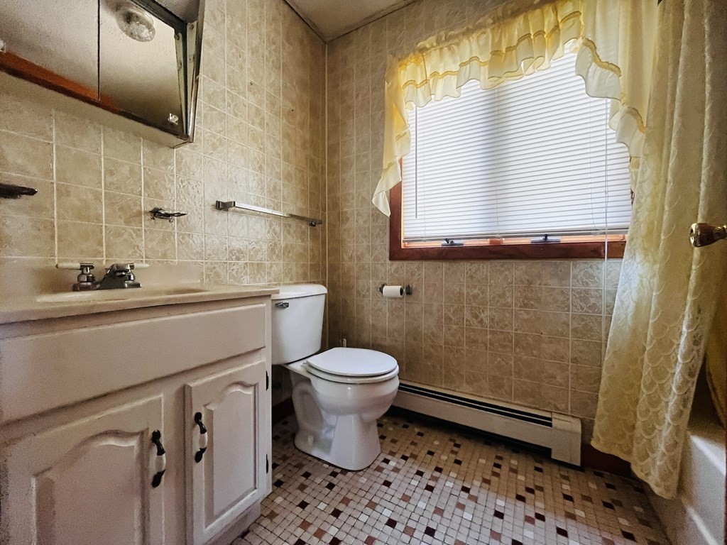 8 Shore Avenue Wareham, MA 02571 - Photo 12 of 18 a bathroom with a sink a toilet and a shower