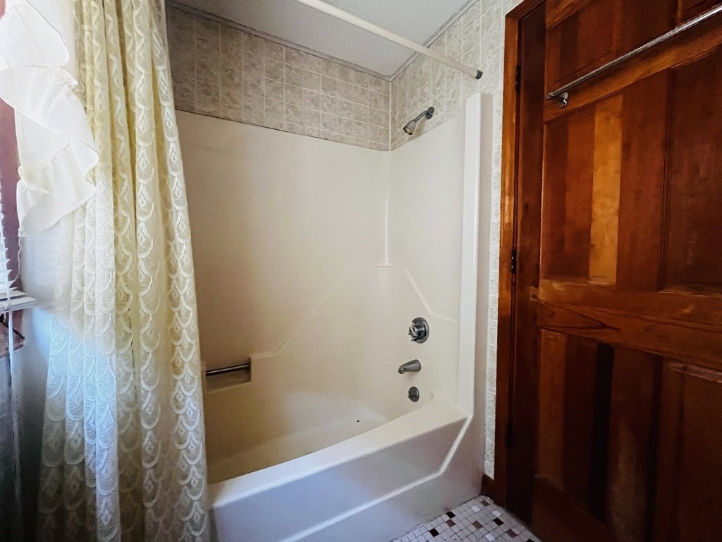 8 Shore Avenue Wareham, MA 02571 - Photo 13 of 18 a bathroom with a bathtub and shower