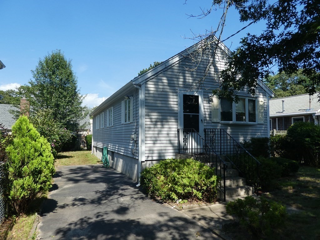 8 Shore Avenue Wareham, MA 02571 - Photo 2 of 18 a front view of a house with garden